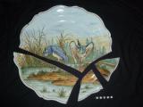 Un  plat en Faience de Quimper revient de restauration